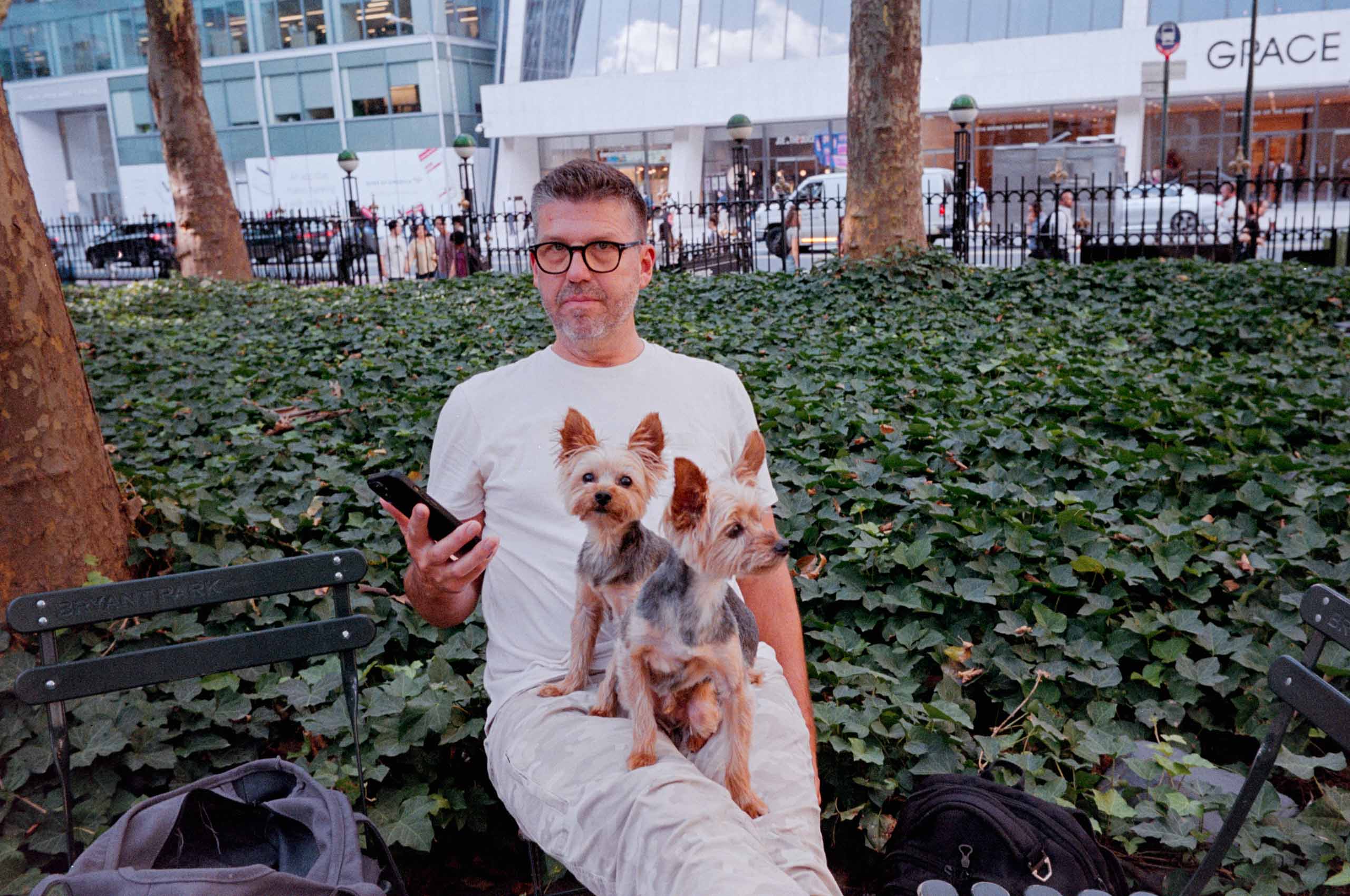 Man with two-headed dog. Bryant Park, New York City. 2023.