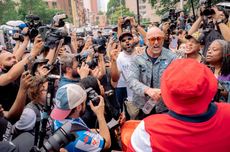 Diddy supporters and detractors stand off outside the courthouse.